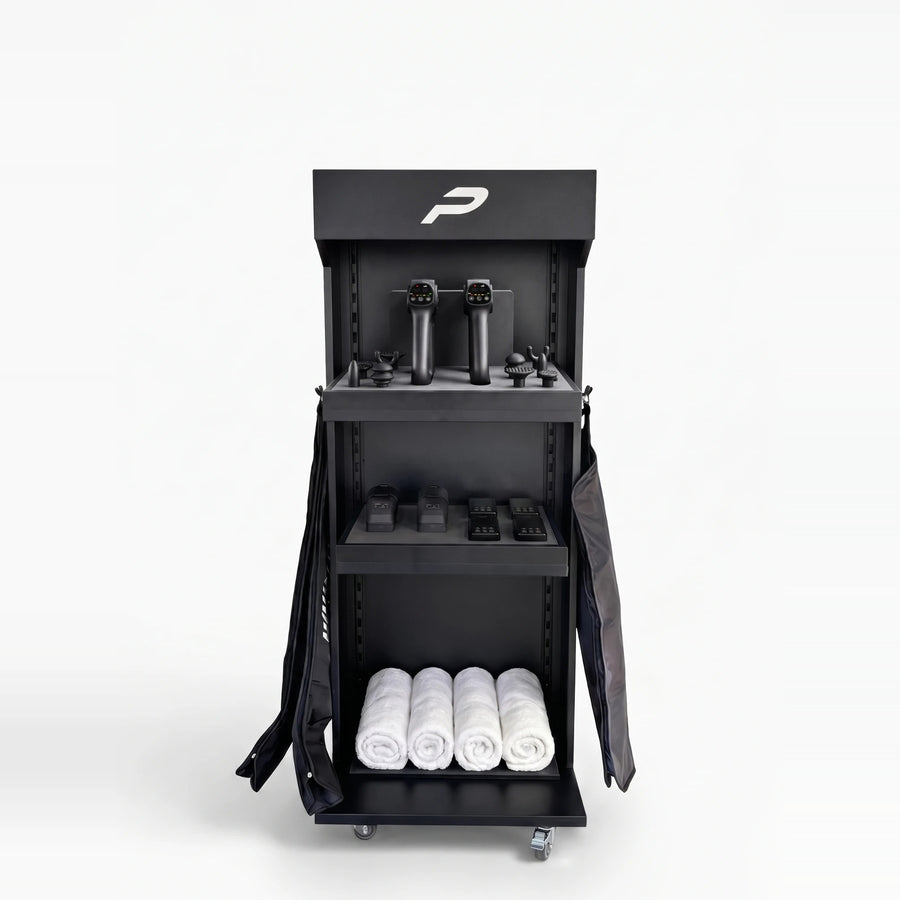 The Premier Recovery Station, black, with two ProGun IR on the top shelf, the control units below and the boots and sleeves at the sides